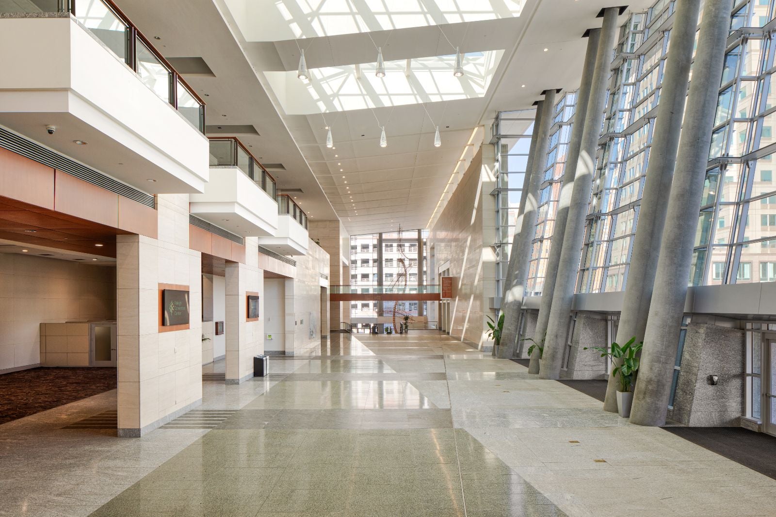 A full view of the empty main lobby of the Raleigh Convention Center facing north in the daytime.