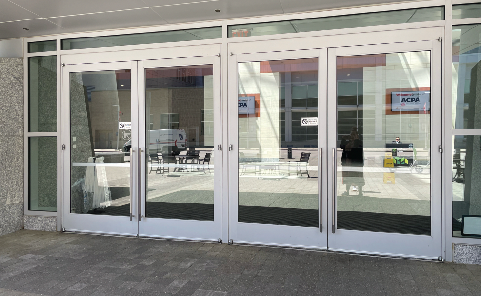 Glass doors leading to the entrance of the RCC main lobby.