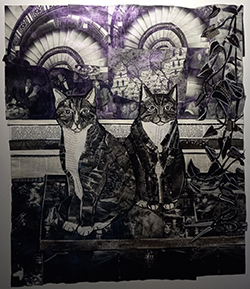 Two black and white cats stand next to one another in front of two purple-tinged swirling staircases. A trailing vine hangs along the right side of the piece.