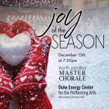 Red mittens holding a heart shaped snowball. Text reads- Joy of the Season 