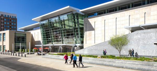 Main entrance of the RCC as people walk by.